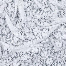 Кружево из хлопка. Растительный узор (стилизованные цветы, ветви, листья). Имитация коклюшечных кружев. Цвет белый в наличии