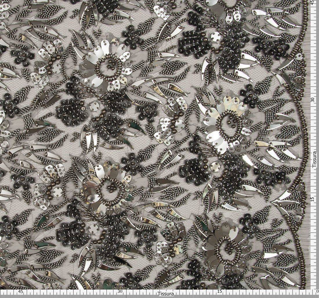 Ткань Кружево вышитое, декорированное цветами из бисера, металлизированными пайетками и фигурными элементами. Основа- кружево из искусственного шелка. Цвет основы- пепельный, цвет вышивки- оружейная сталь в наличии