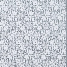 Кружево из хлопка. Растительный узор (стилизованные цветы, ветви, листья). Имитация коклюшечных кружев. Цвет белый в наличии